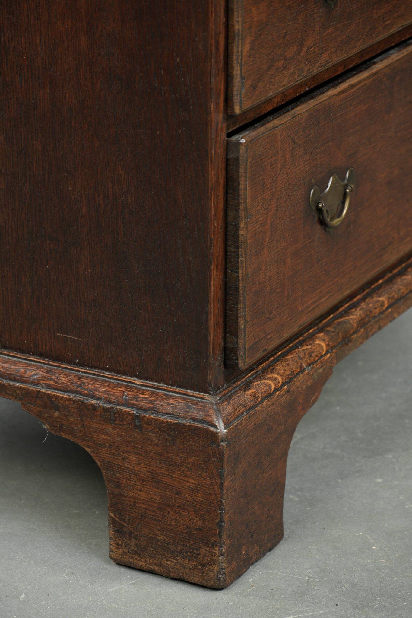 Antique English oak secretary from the 18th century with a stepped interior