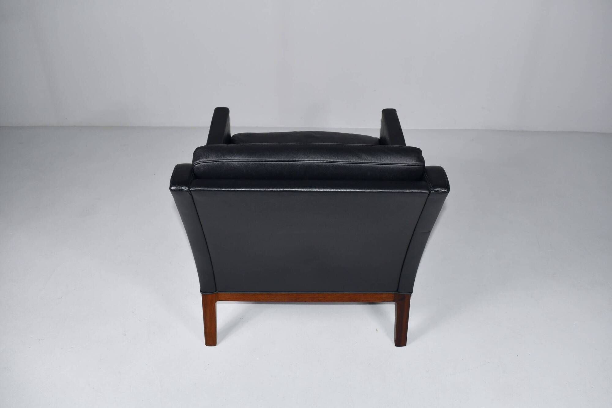 Leather and rosewood armchair by Kai lyngfeldt-Larsen. Denmark