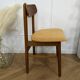 Scandinavian chair with mustard yellow fabric