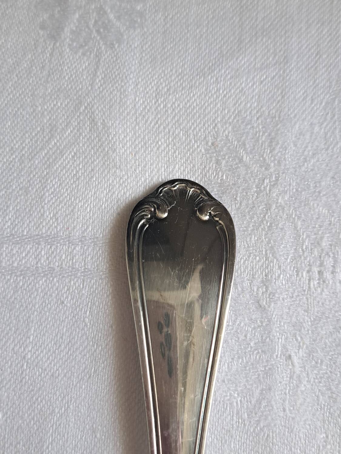 Silver metal cake peeler.