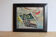 Still life painting with a pistol signed HDA PASSANO