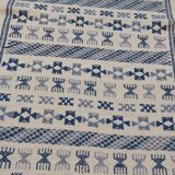 Handmade white and blue ethnic carpet