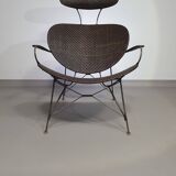 Armchair designed by Yuzuru Yamakawa  Metal frame.  Seat and back in braided rattan.