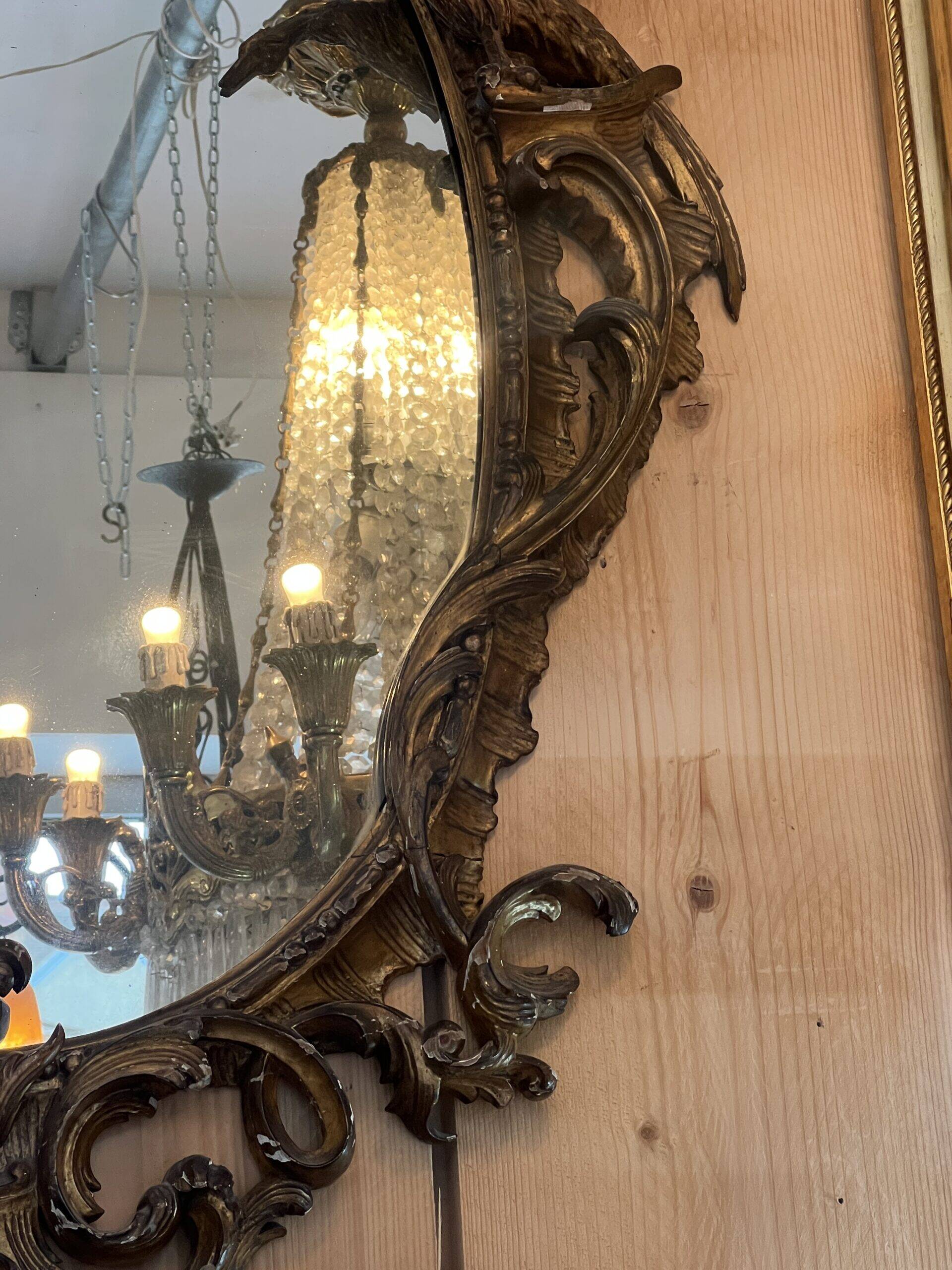 Large gilded wooden mirror, richly carved with winged dragons, 19th century