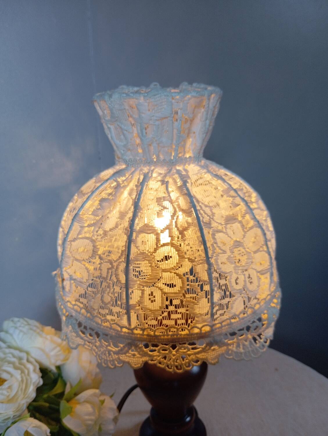Table lamp with romantic wood and lace ambiance, retro chic