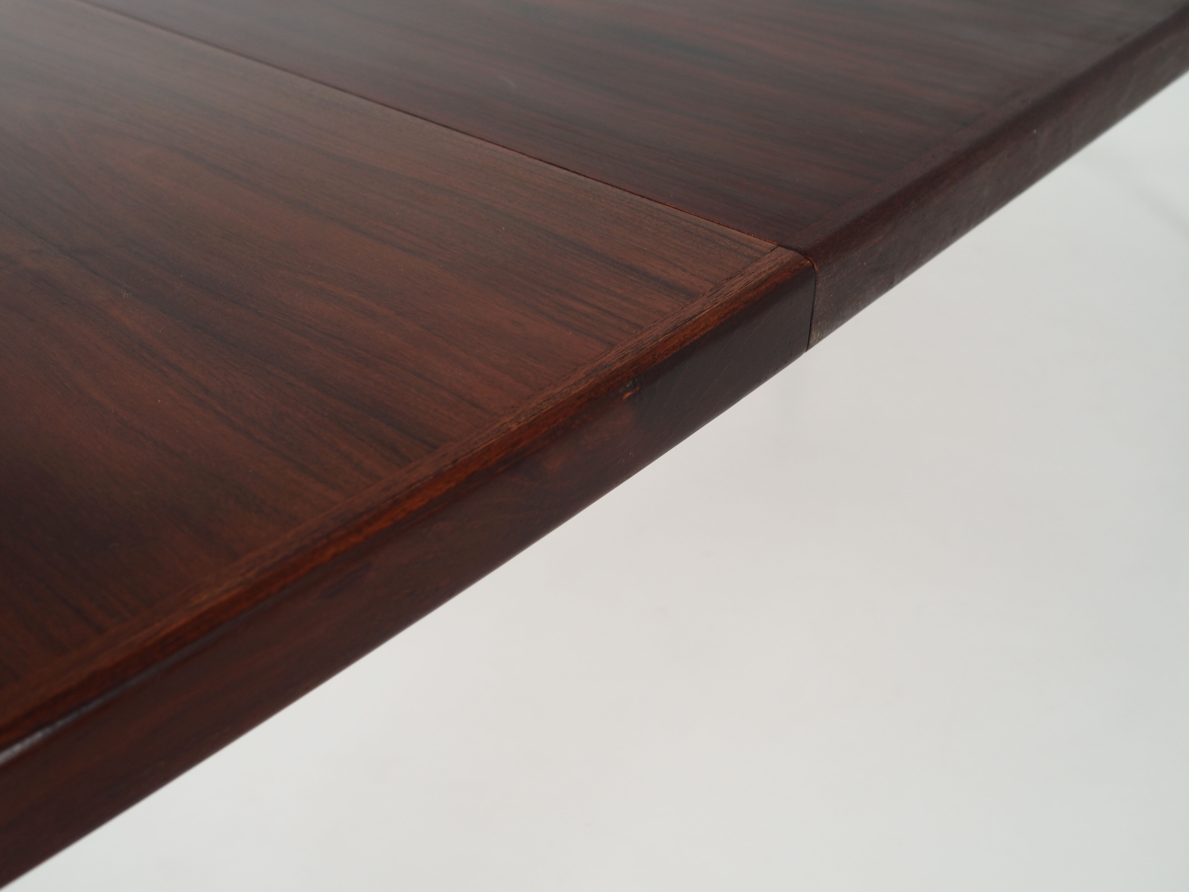 Oval table, covered with rosewood veneer.Design of the 70s