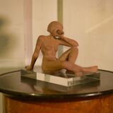 Terracotta sculpture of a seated woman by Norbert Treca contemporary art.