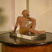 Terracotta sculpture of a seated woman by Norbert Treca contemporary art.