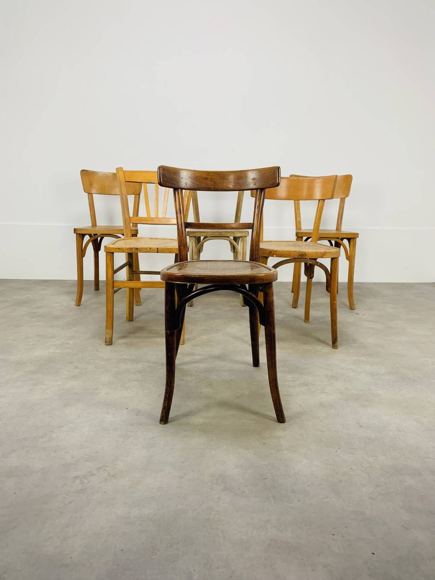6 mismatched Baumann & Luterma bistro chairs, wood, 1960s