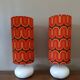 Two lamps with a seventies psychedelic wave print.