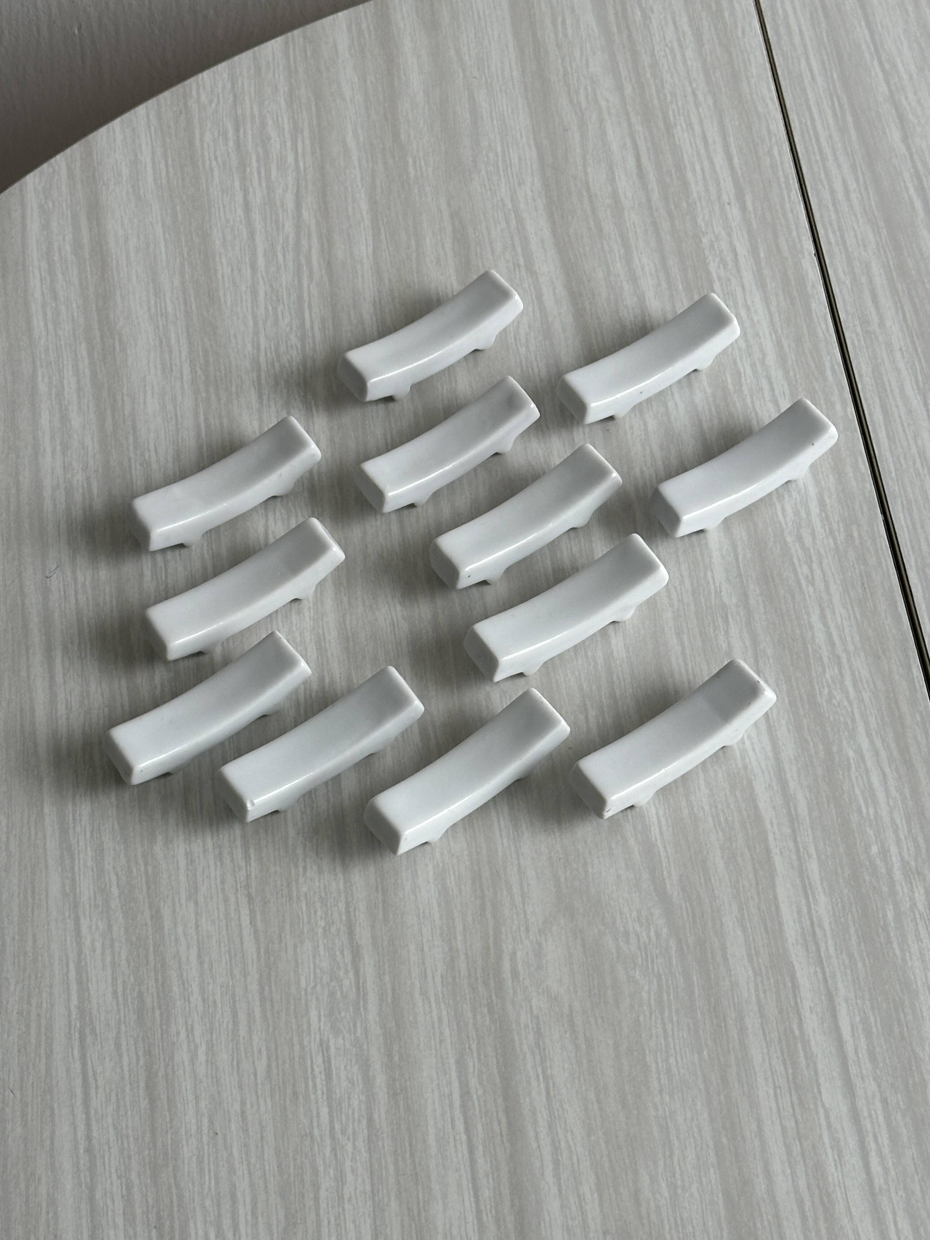 Set of white porcelain chopstick holders