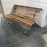 Old cast iron garden bench with oak slats