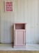 Antique bedside table revamped in pink.