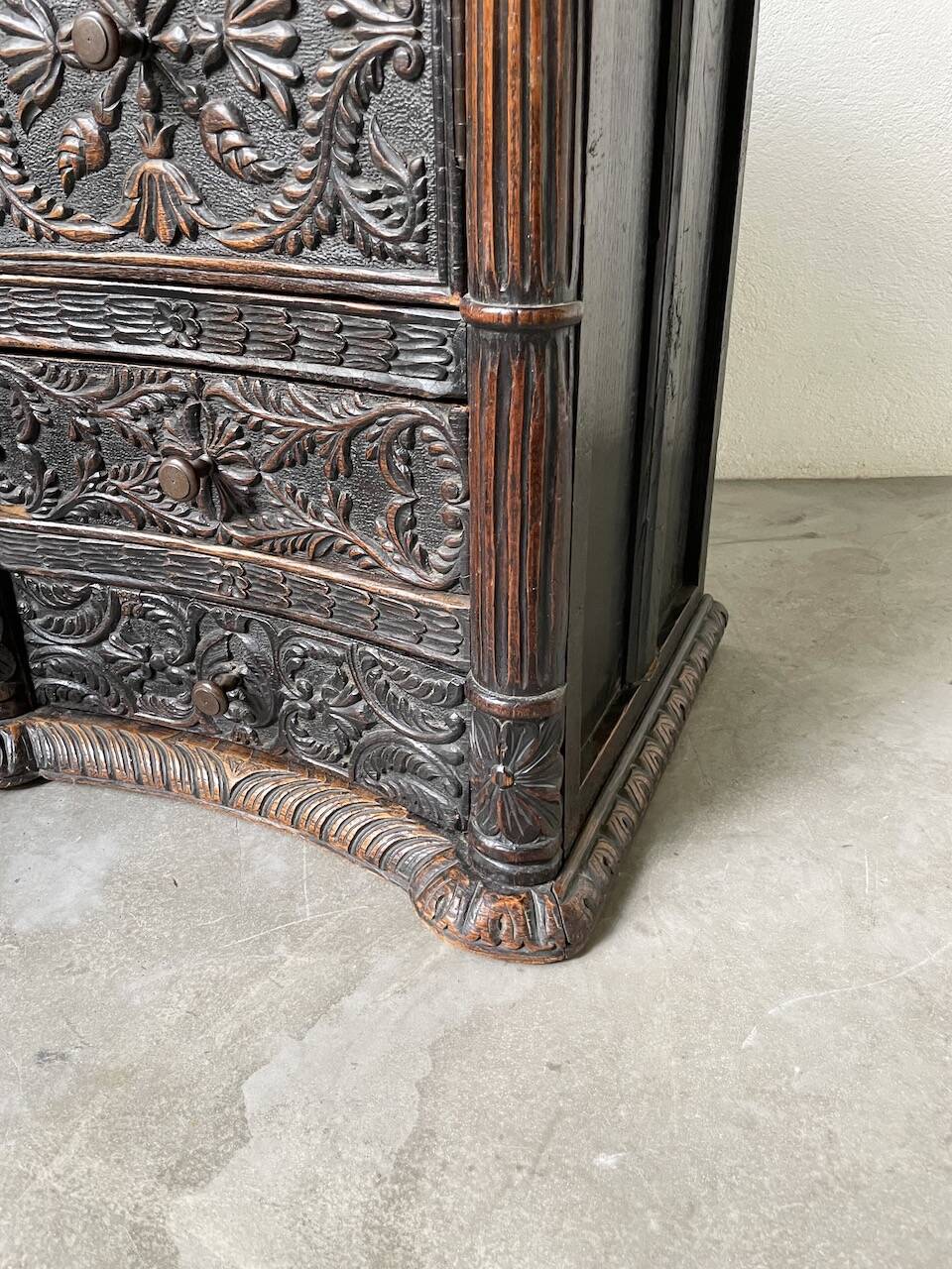 19th century chest of drawers in carved blackened pine