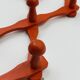 Vintage orange accordion coat rack