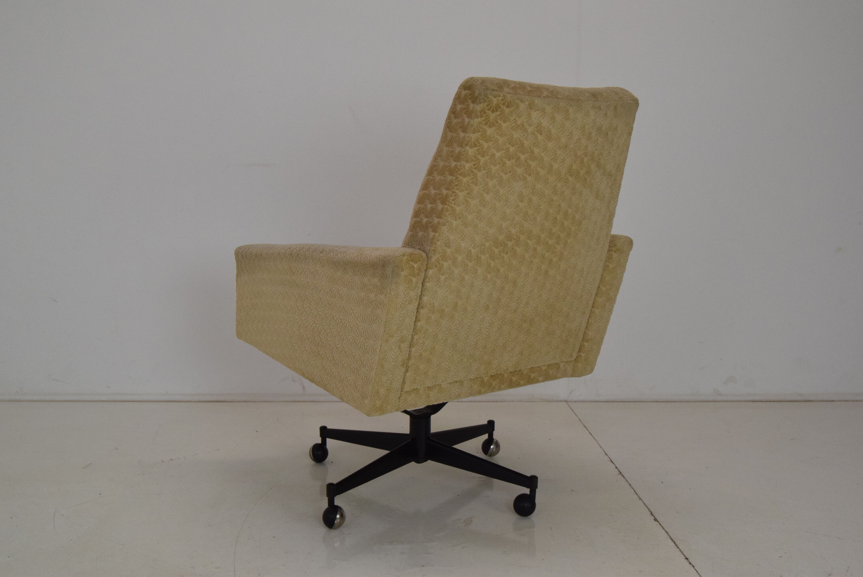 Mid-century swivel armchair with wheels 1970's
