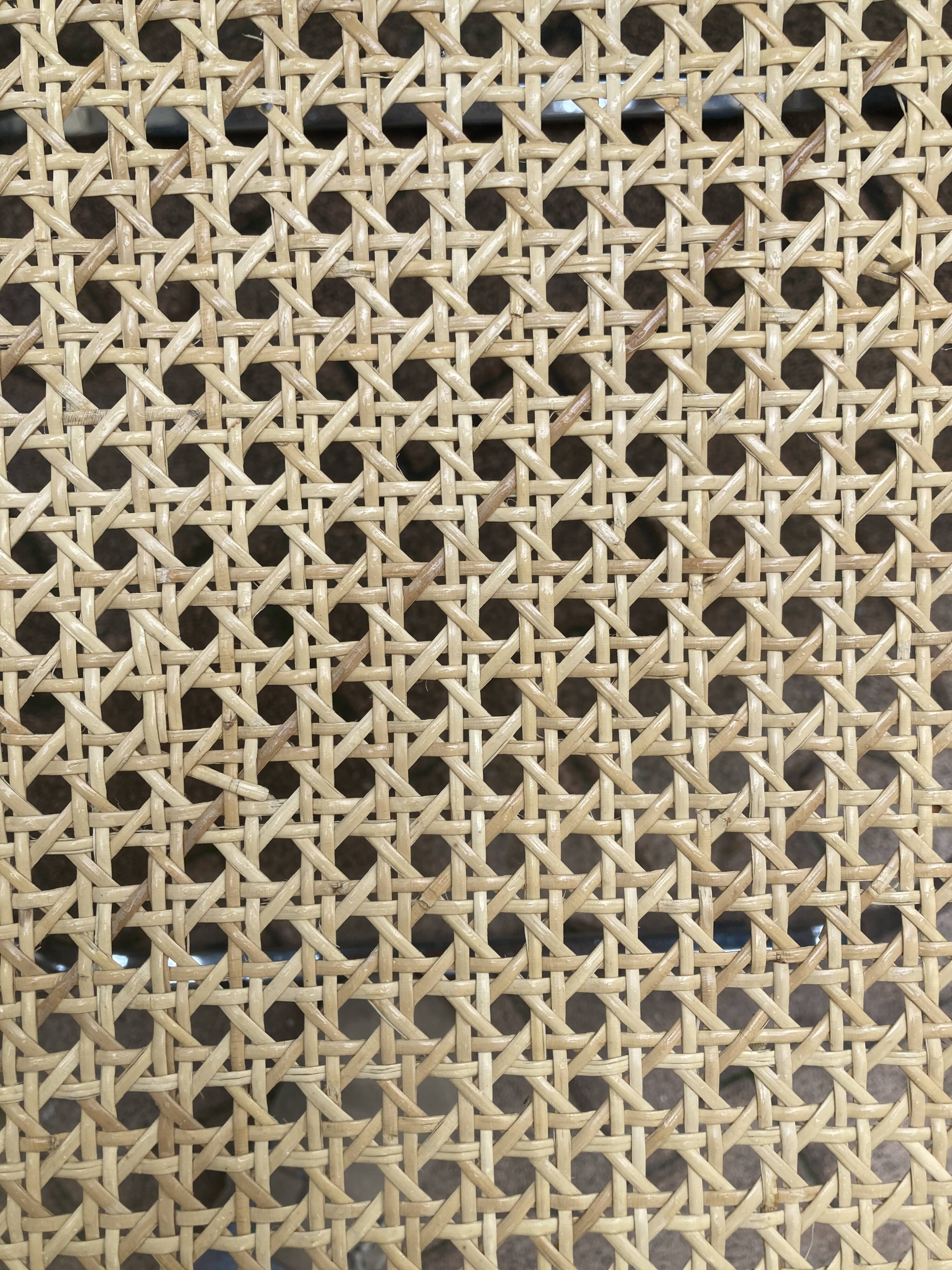 Plia chairs by Castelli in wood and cane.