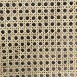 Plia chairs by Castelli in wood and cane.