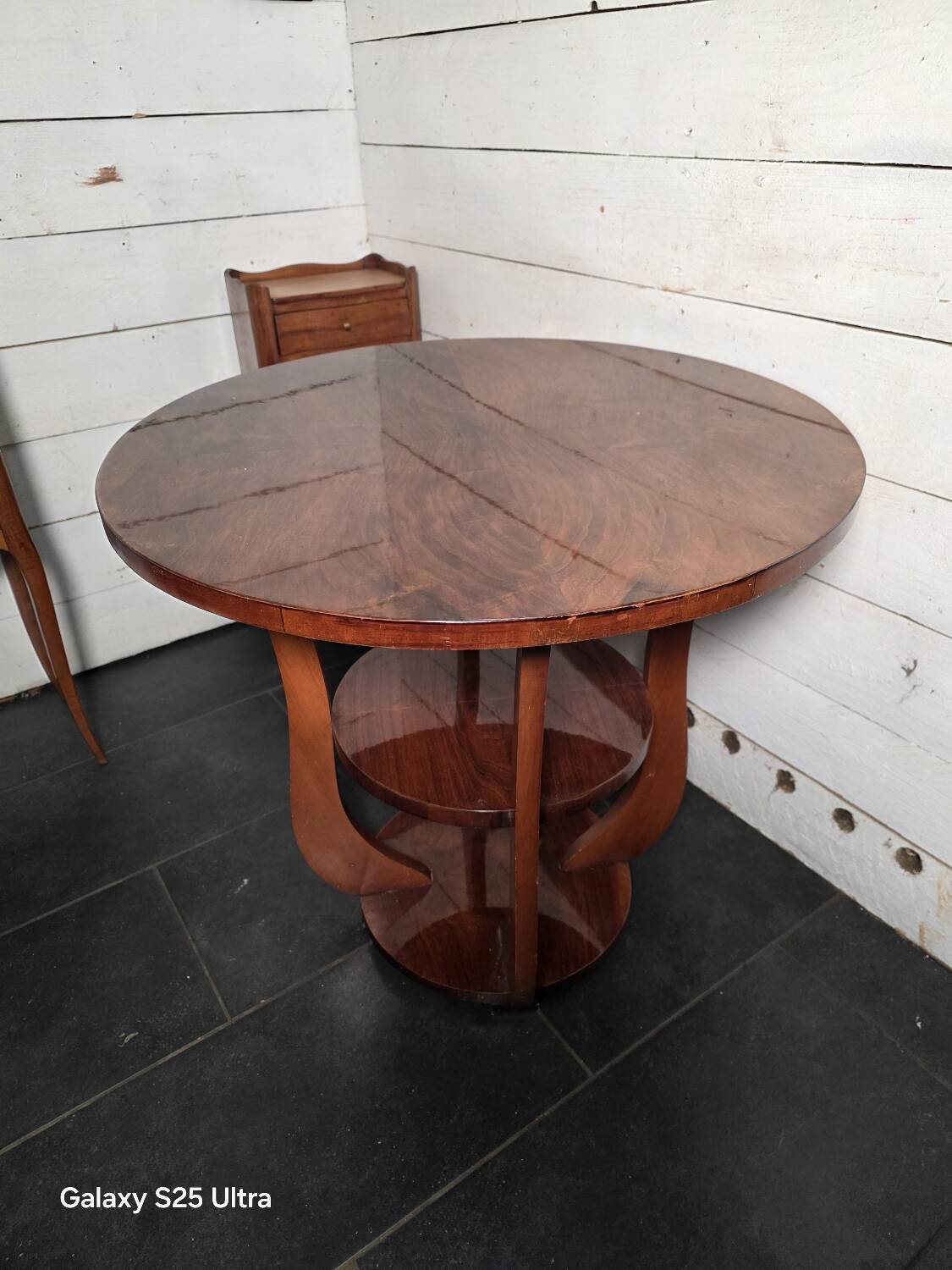 Art Deco walnut gueridon with double top from the 1930s.