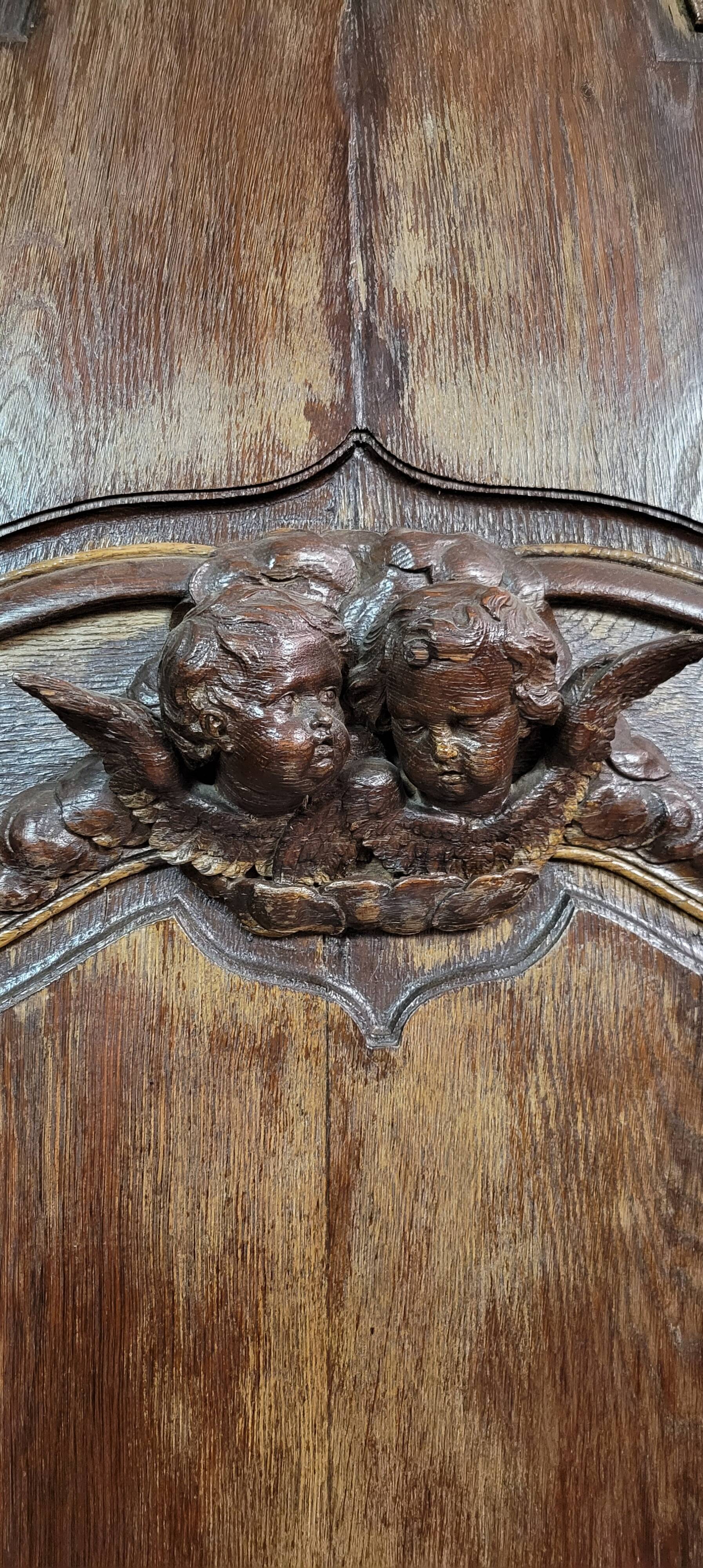 Pair of 18th century oak woodwork castle doors with putti