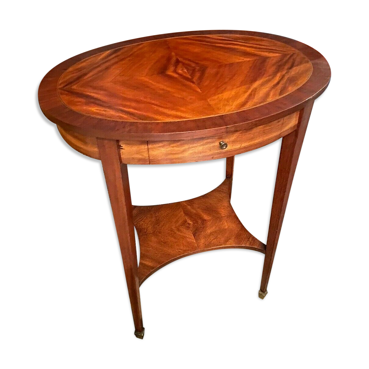Oval pedestal table with a drawer and a tablet decorated inlaid Louis XVI style
