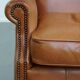 Fauteuil à oreilles en cuir de vache