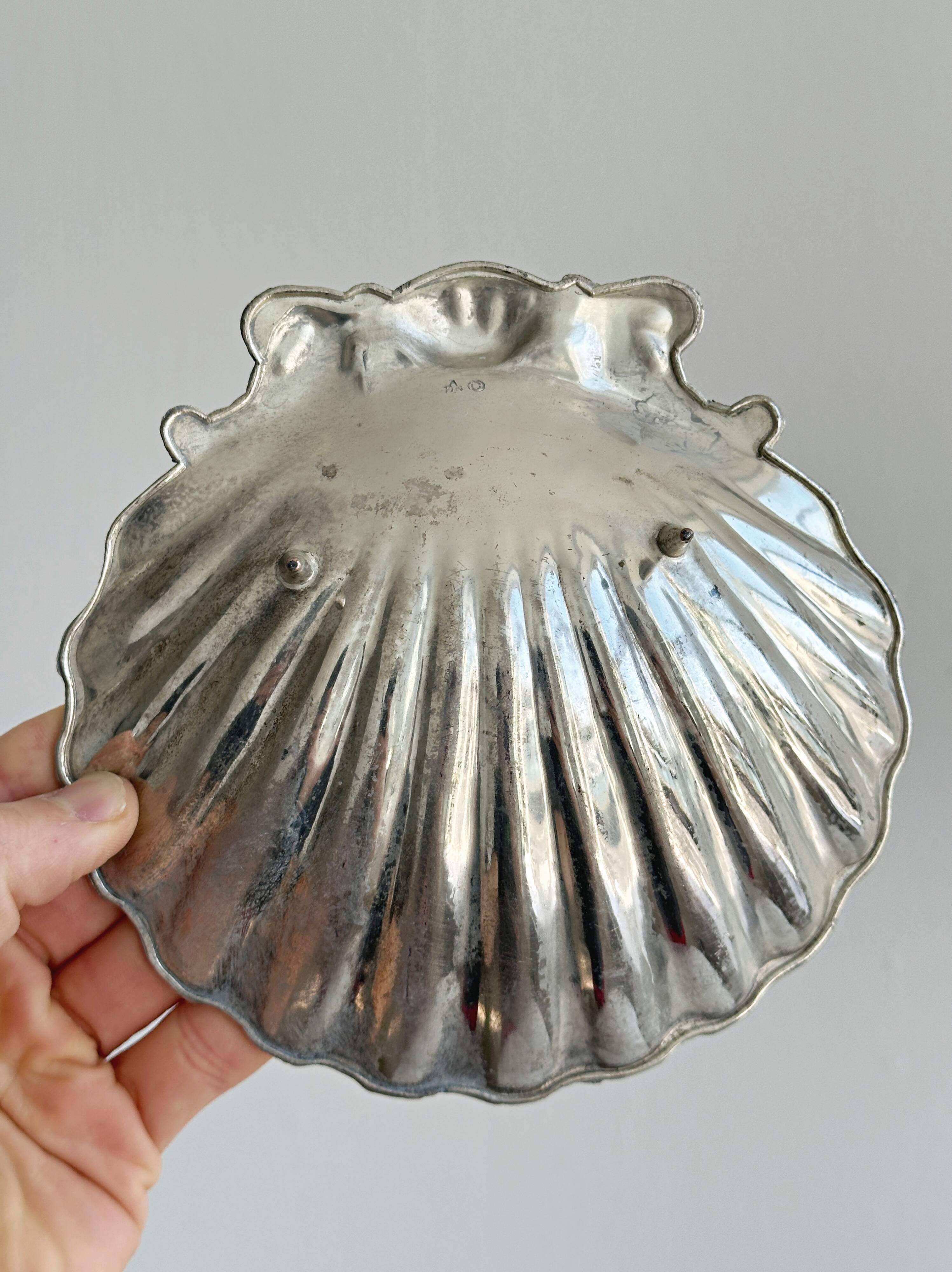 shell-shaped metal pocket tray with patina