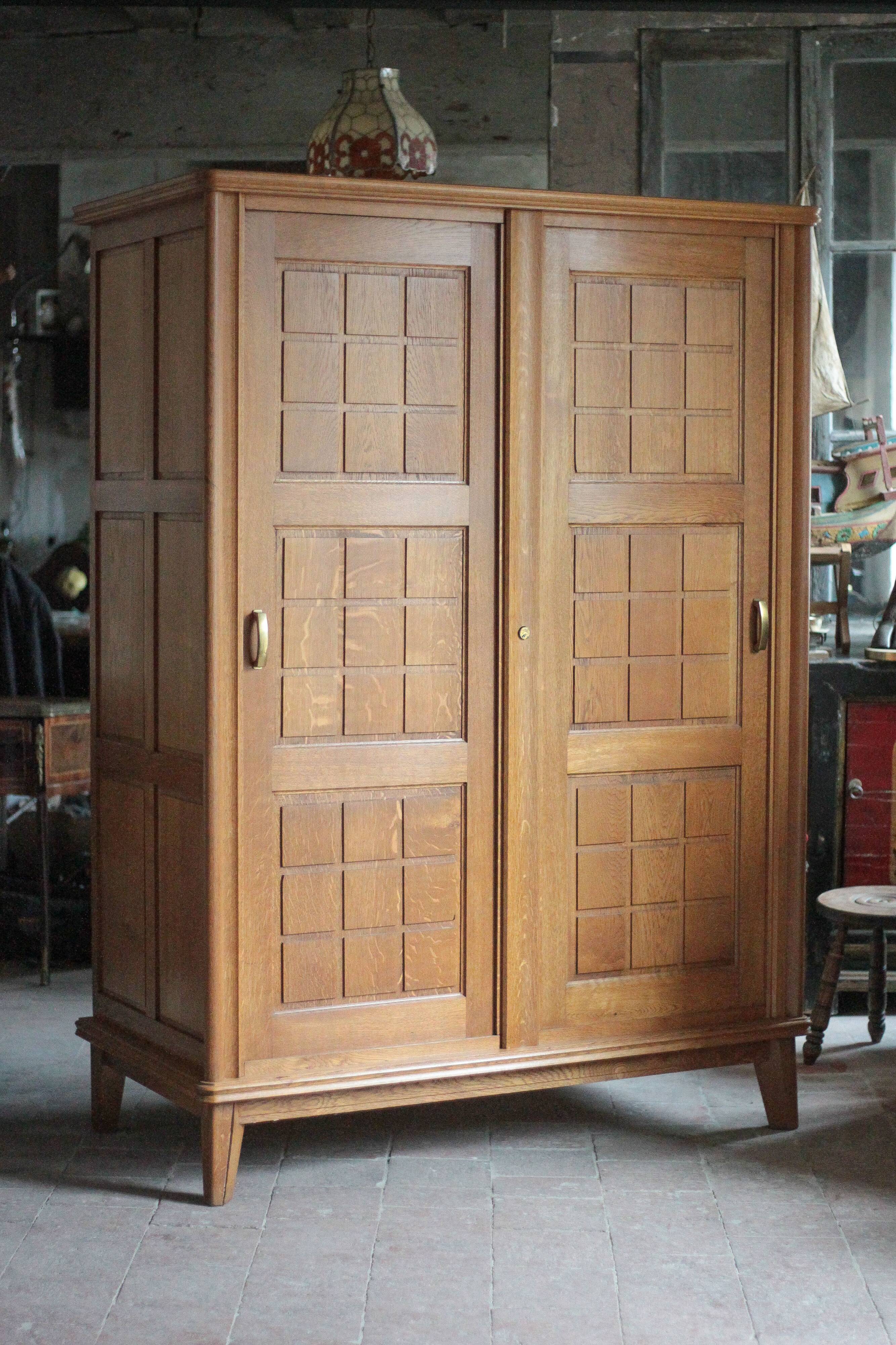 Vintage wooden wardrobe with sliding doors.