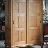 Vintage wooden wardrobe with sliding doors.