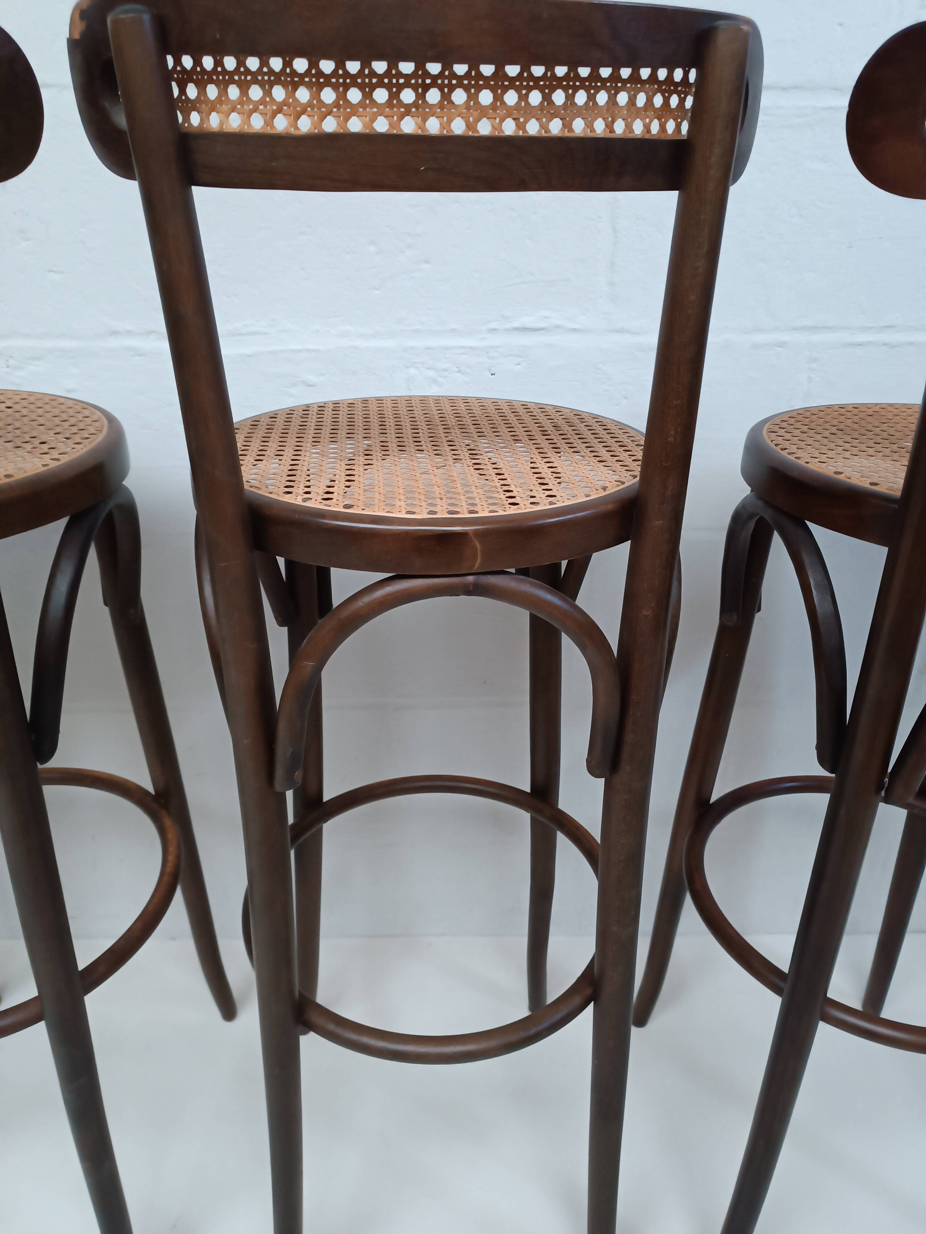 4 curved wood and cane bar stools