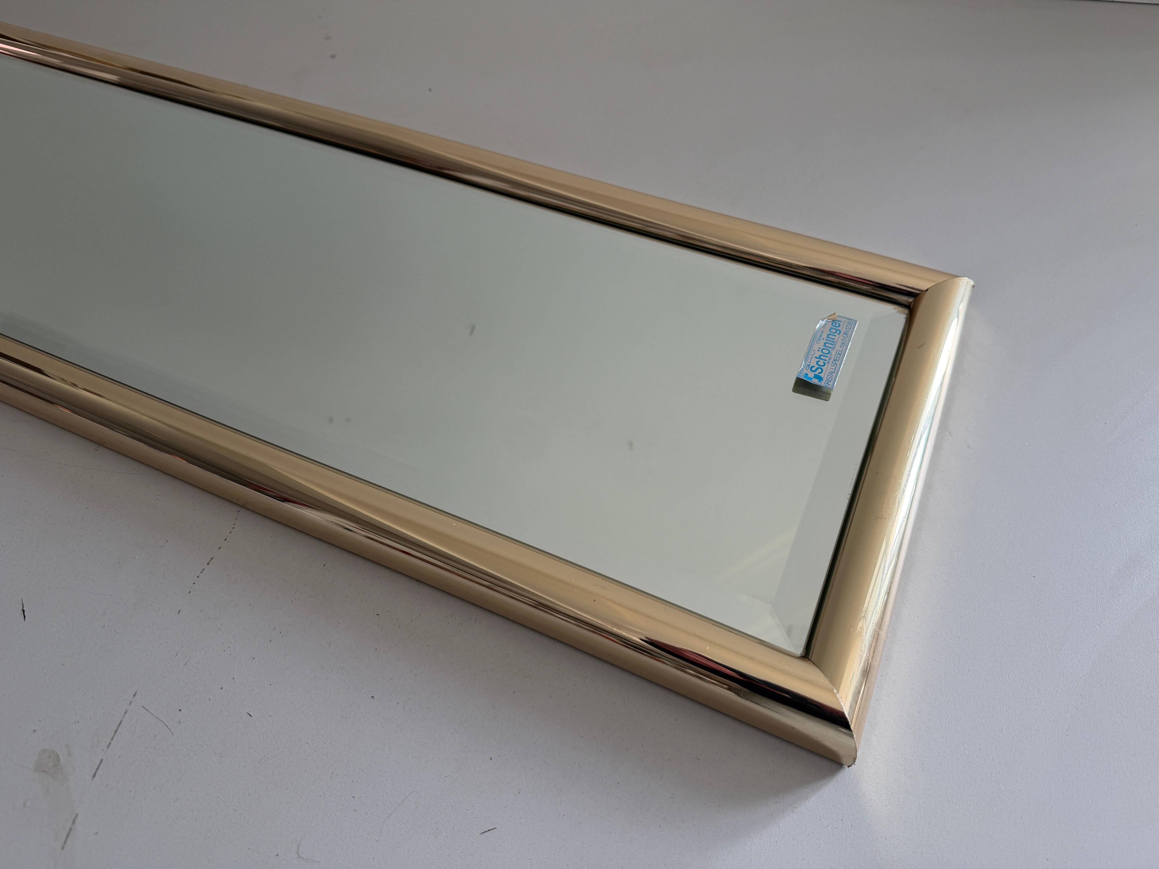 Rectangular wall mirror with a gold metal frame by Schöninger, 1970s, Germany.