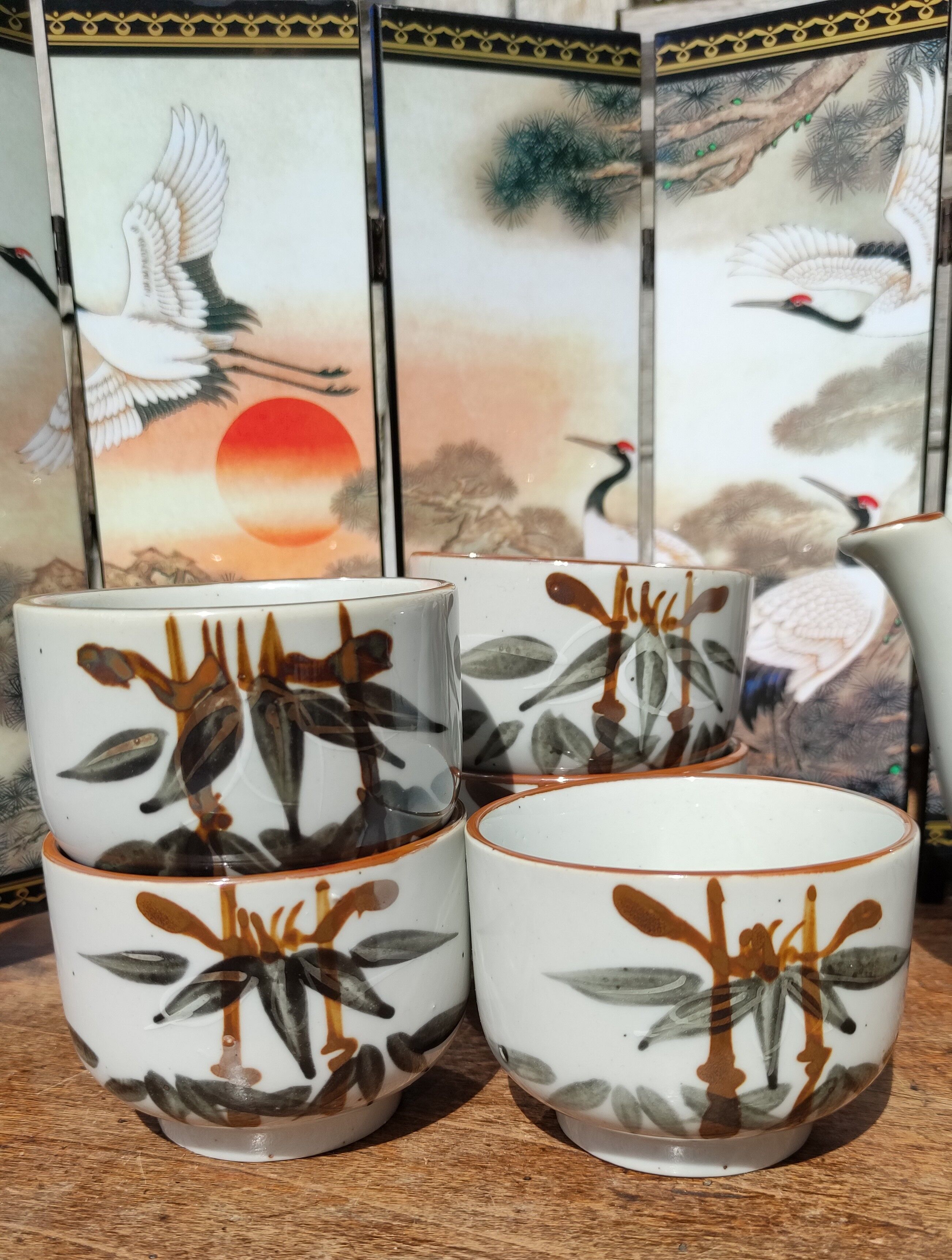 Asian set of a teapot and its cups