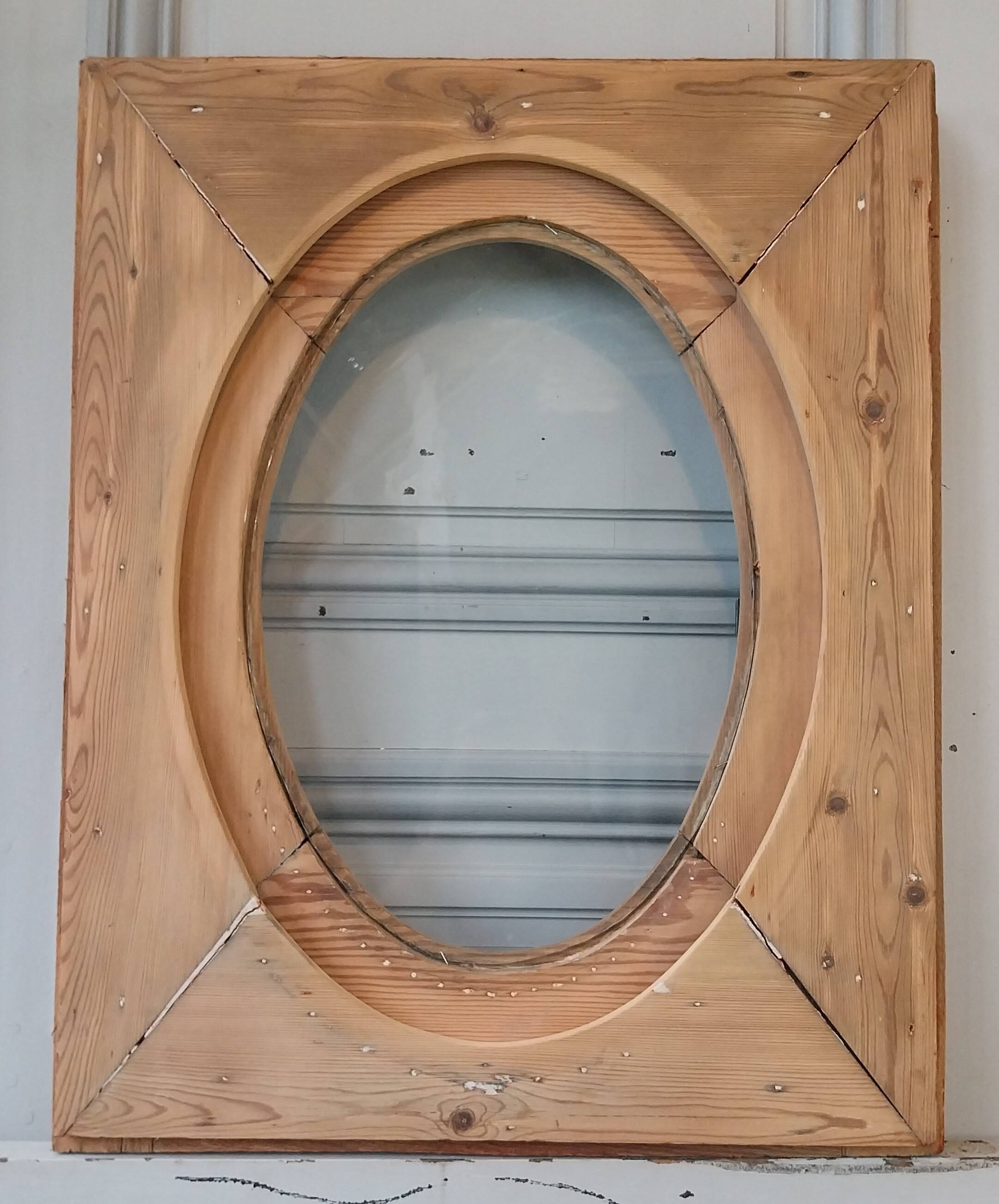 Old bullseye window with oval glass