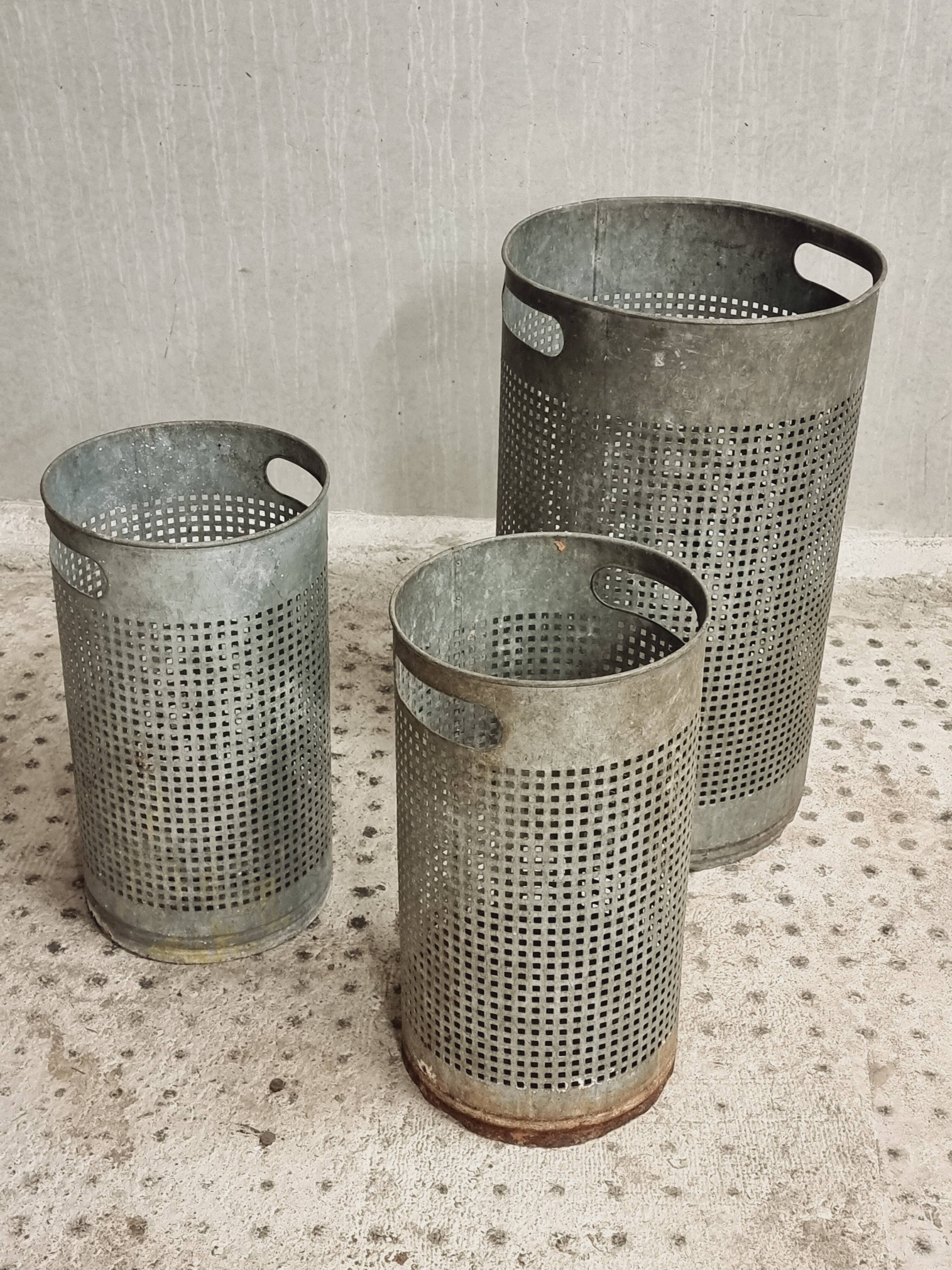Vintage set of perforated metal waste bins