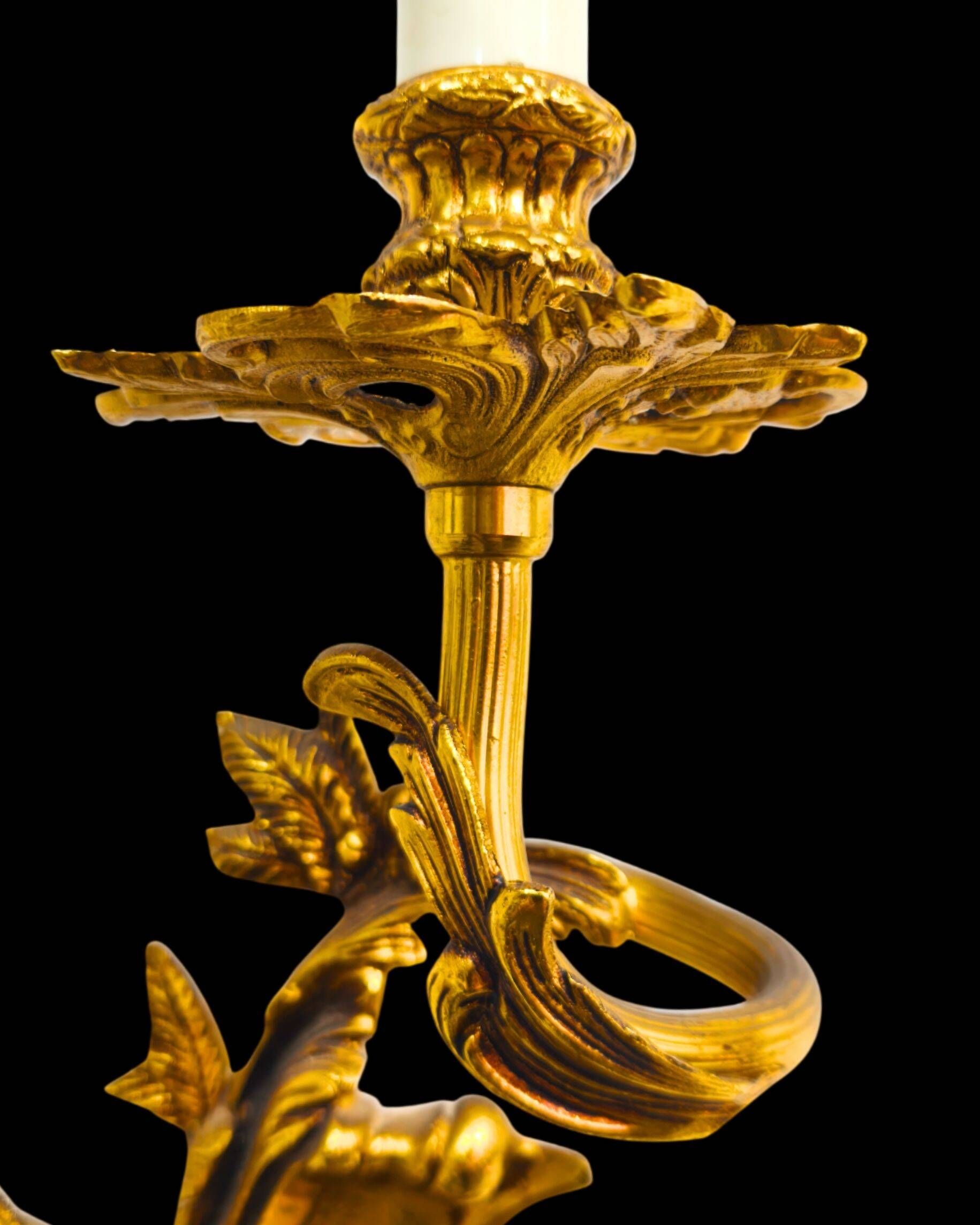 Pair of gilded bronze wall sconces in Rococo style, three lights.