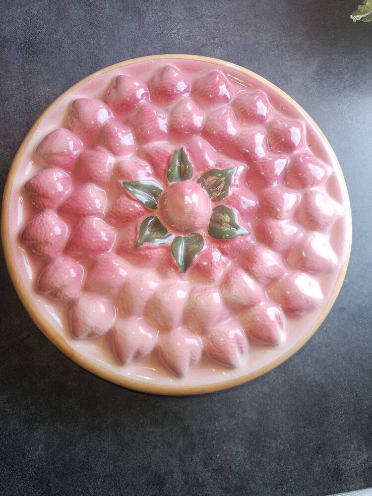 Glazed ceramic dessert plate with strawberry design.