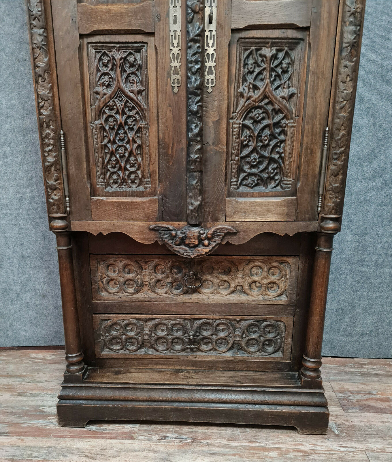 Gothic Renaissance style cabinet with solid oak putto around 1850