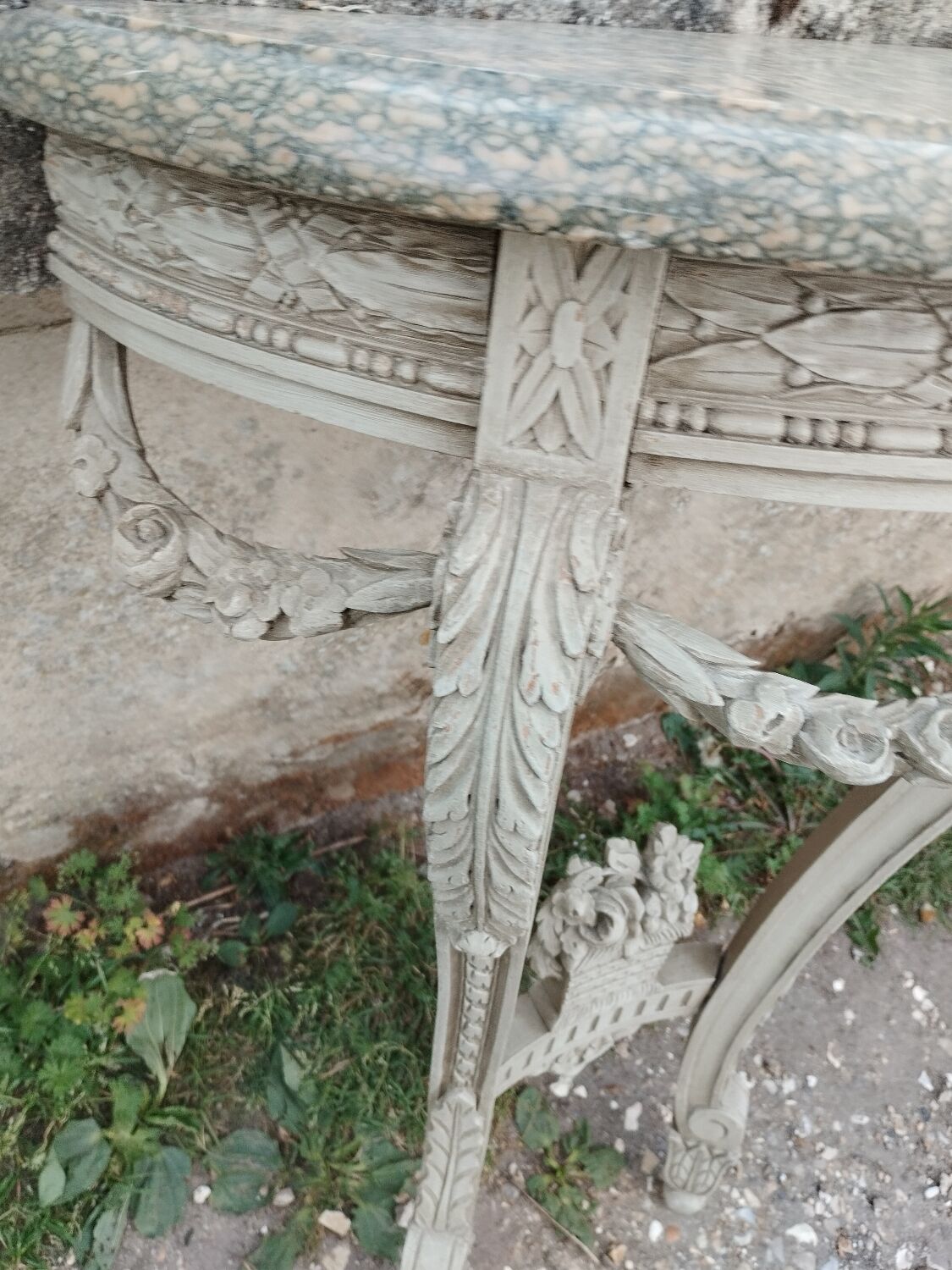 Beautiful antique wooden console with a marble top in Louis XVI style.