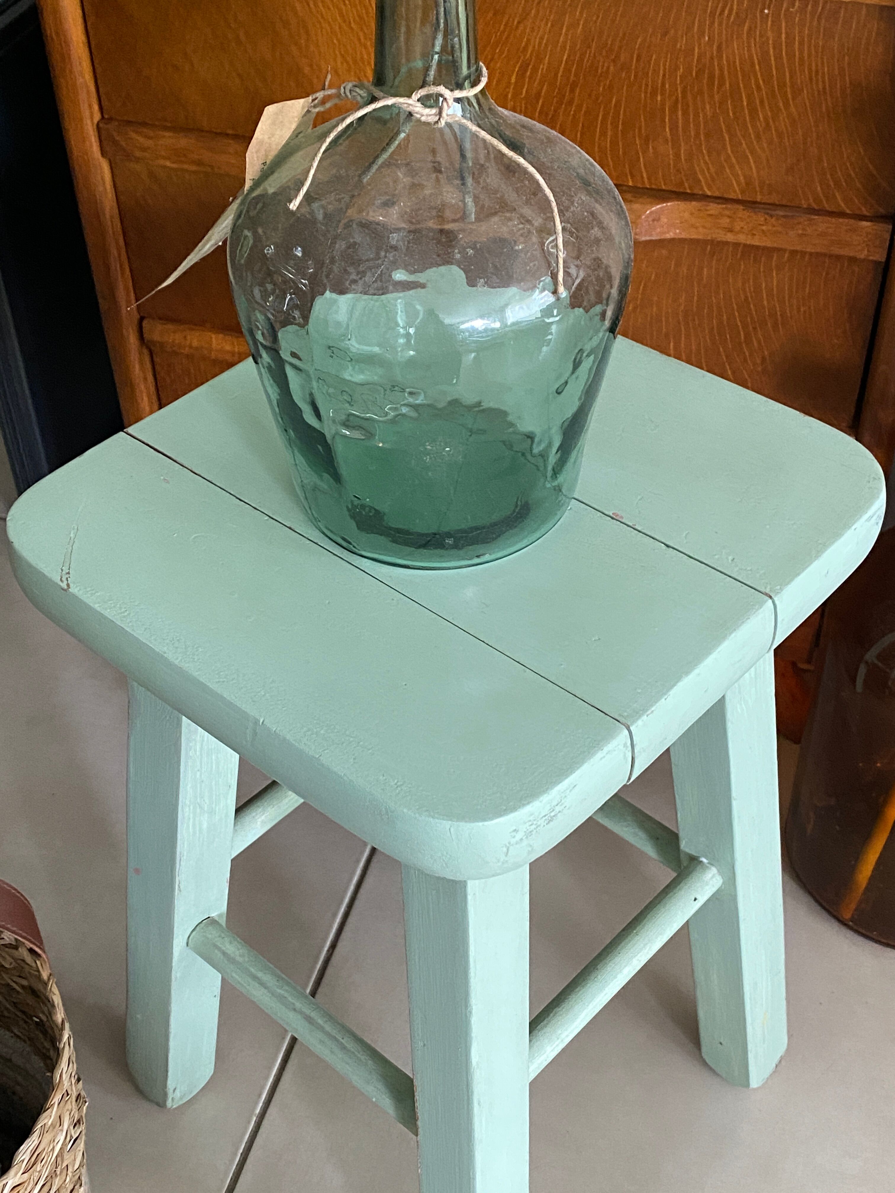 Old almond green wooden stool