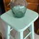 Old almond green wooden stool