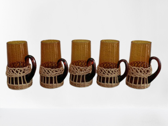 Fruit juice or vintage lemonade service in glass and wicker.