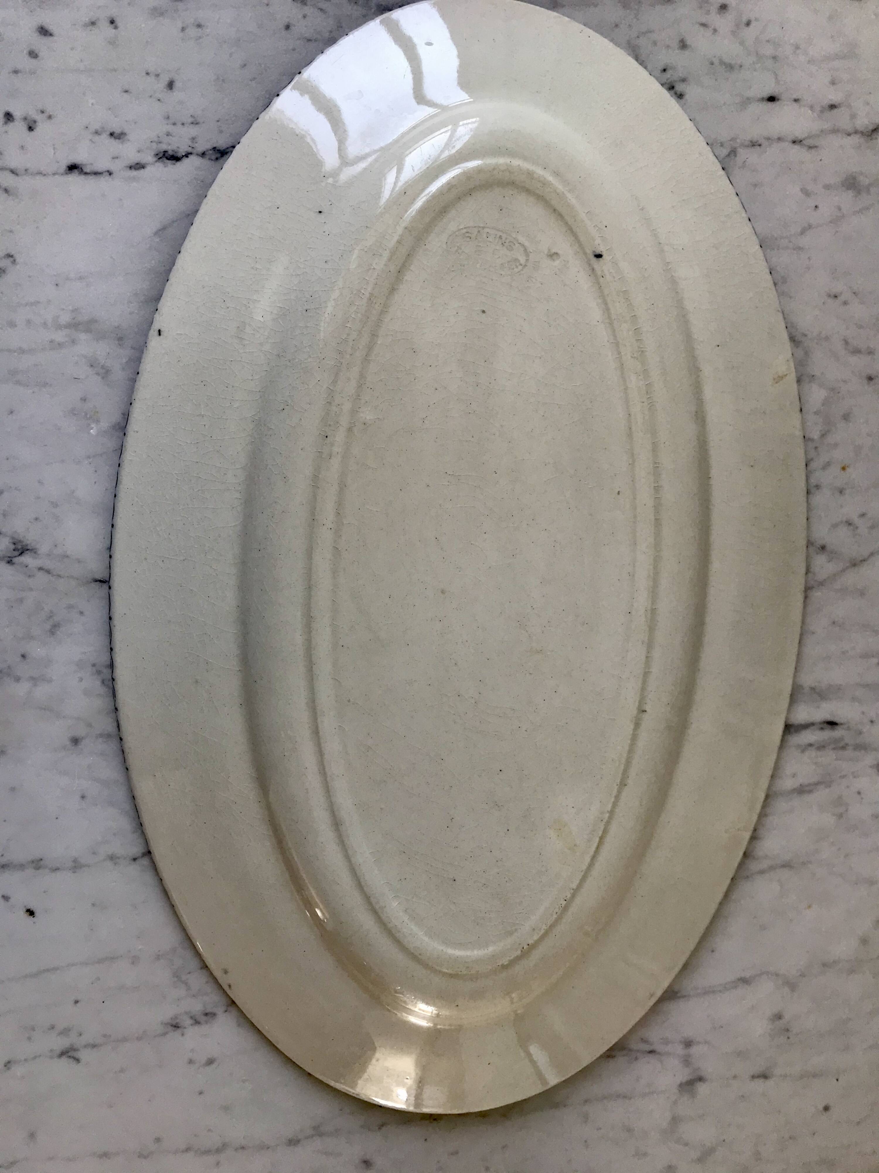 Oval dish in terre de fer bleu xixth