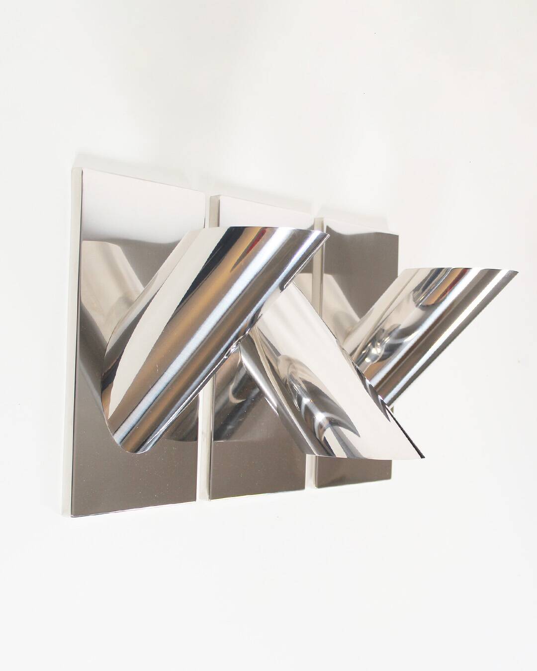 Set of three large sculptural vintage chrome metal wall lights