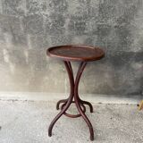 Pedestal table in curved wood