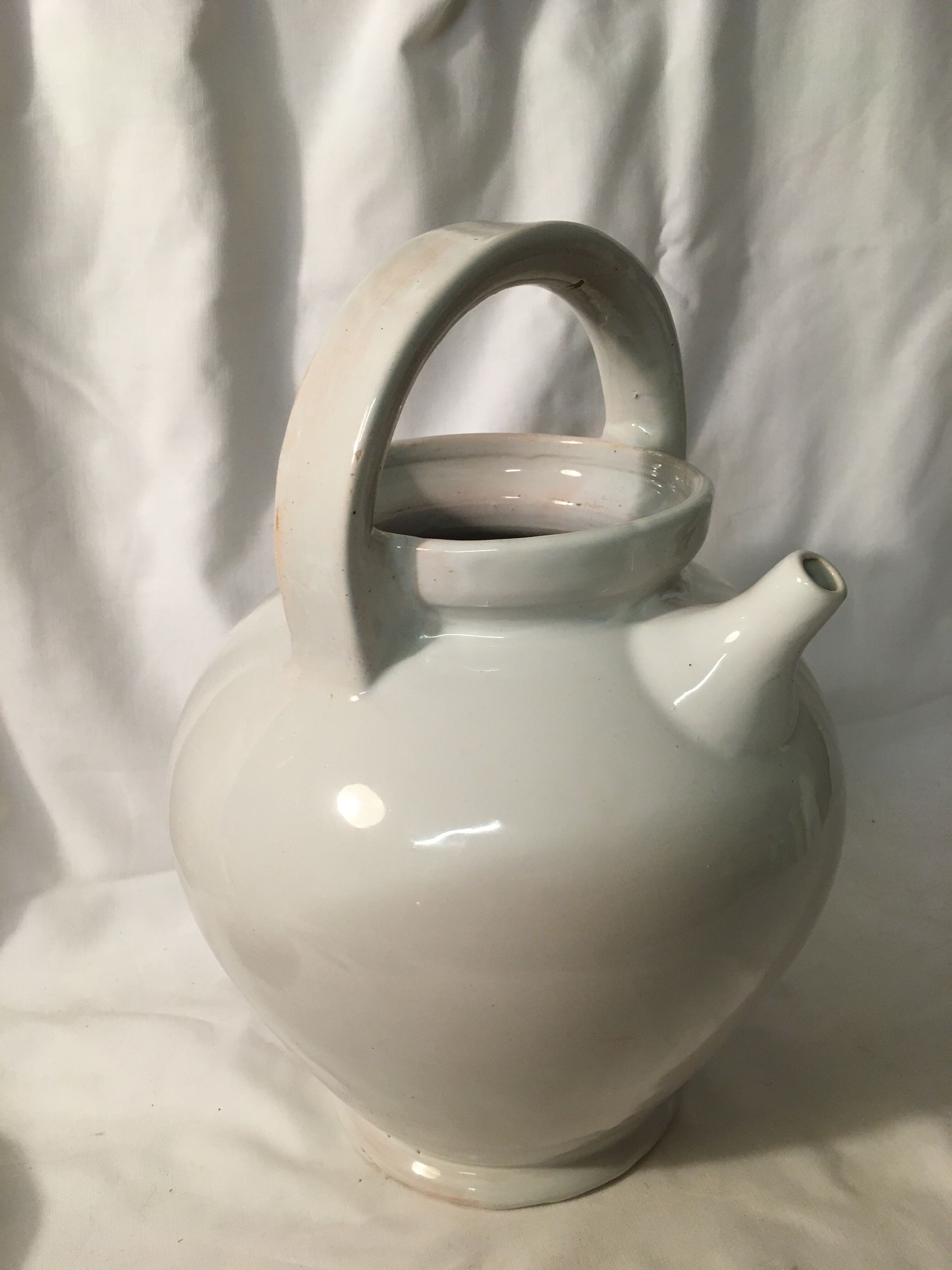 Old chevrette / pitcher in white earthenware