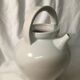 Old chevrette / pitcher in white earthenware