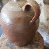 Vernified sandstone oil jar with handle