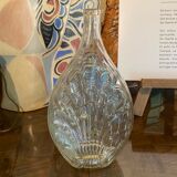 Shell bottle in molded glass