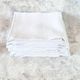 12 antique French linen towels with damask embroidery with "GB" anagrams.