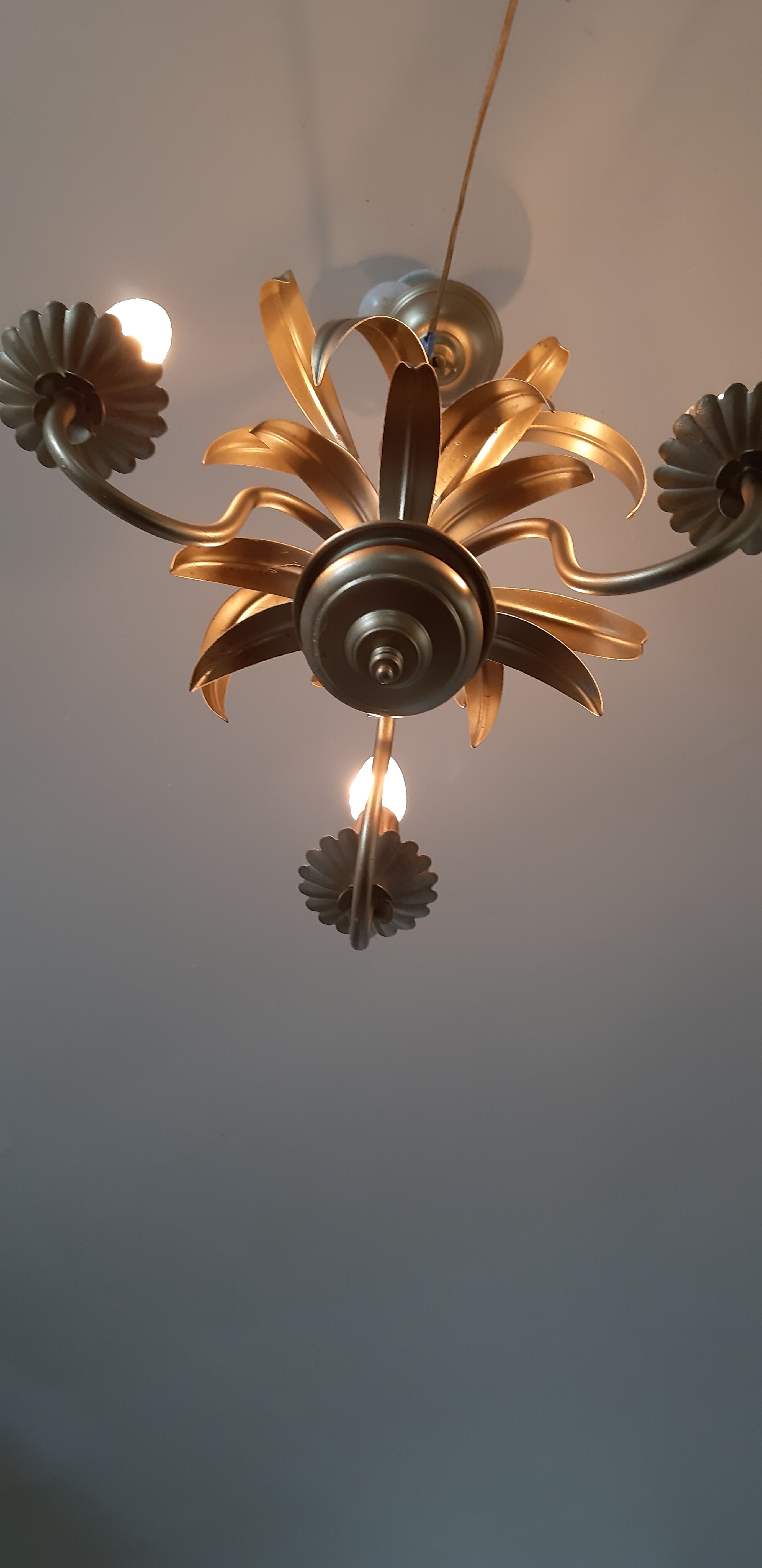Vintage chandelier in golden metal